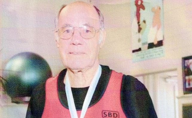 Bernard Collins wearing one of his medals. Photo / Supplied