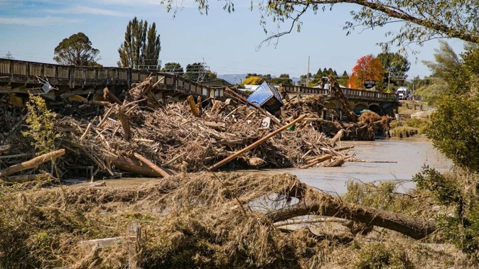 The Redclyffe bridge, destroyed in Cyclone Gabrielle, pictured in February with wood debris piled against it. Photo / Warren Buckland.