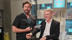 Shortland Street cast member Michael Galvin (Dr Chris Warner) checks Paul Goldsmith's blood pressure.