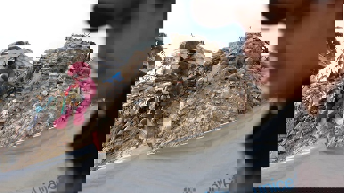 A Palestinian youth walks past an installation composed of stuffed animals set up on a pile of debris, in Khan Yunis in the south Gaza Strip on December 10. Photo / AFP