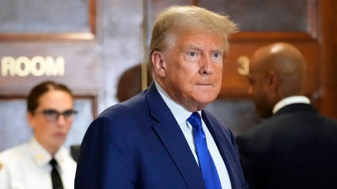 Former US president Donald Trump speaks during a break in his civil business fraud trial at the New York Supreme Court. Photo / AP