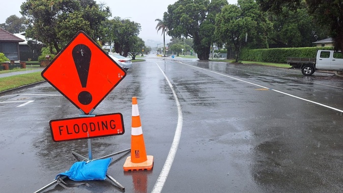 A flooding sign was put up at the Waikanae Beach end of Grey St early on Thursday afternoon, prompted by surface road flooding either side of the Awapuni Rd / State Highway 35 / Grey St roundabout in Gisborne.