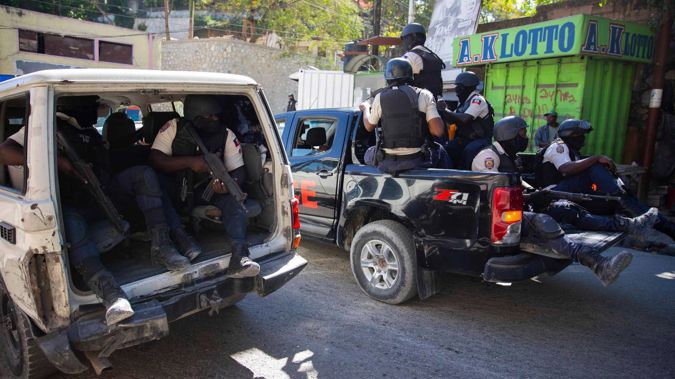 Police on patrol after recovering the bodies of slain journalists in Port-au-Prince, Haiti, on Friday, January 7, 2022. Photo / AP