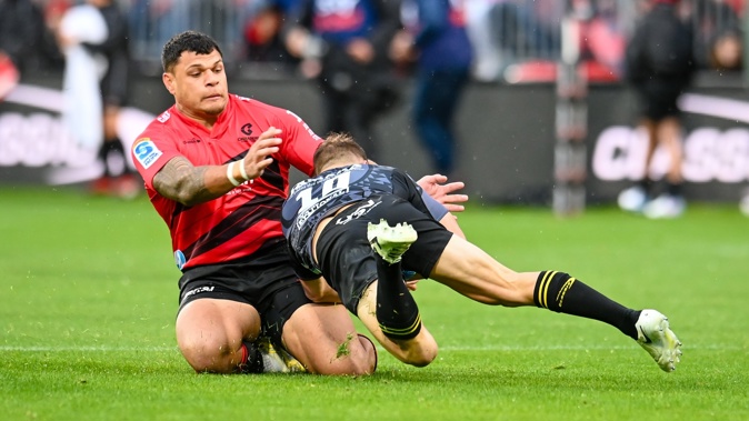 Levi Aumua tackles Brett Cameron of the Hurricanes. Photo / Photosport