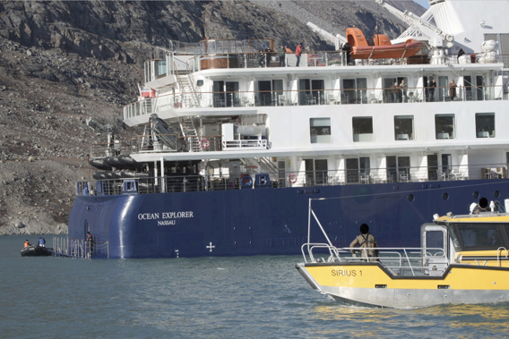 The 104.4-meter (343-foot) long and 18-meter (60 foot) wide Ocean Explorer ran aground on Monday in Alpefjord in the Northeast Greenland National Park. Photo / SIRIUS/Joint Arctic Command via AP