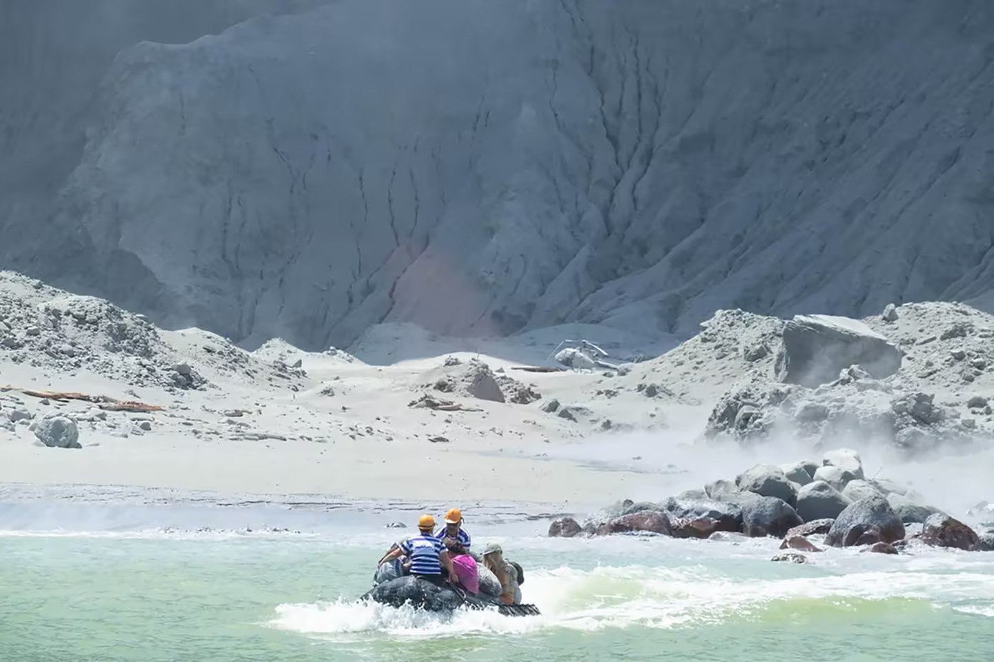 Tourists are ferried off Whakaari/White Island after the eruption. Photo / Michael Schade