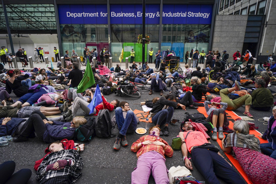 The U.K. division of climate change protest group Extinction Rebellion says its activists would temporarily stop blocking busy roads, gluing themselves to buildings and engaging in other acts of civil disobedience because such methods have not achieved their desired effects. Photo / AP