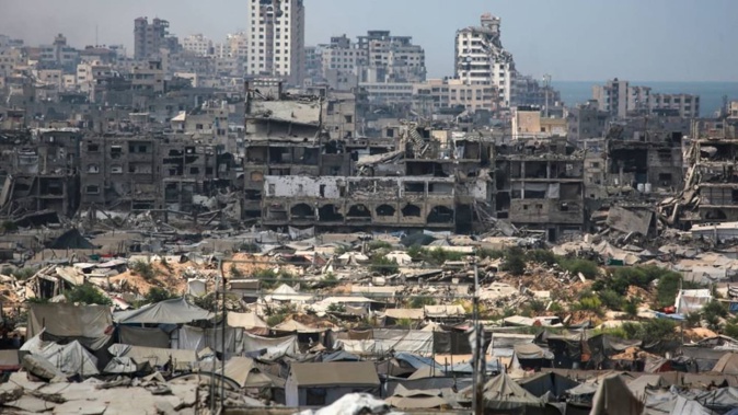 Buildings destroyed in Israeli strikes surround makeshift shelters for displaced Palestinians in Gaza City. Photo / Bashar Taleb, AFP