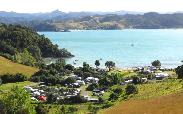 DOC campgrounds around Northland, like this one at Puriri Bay, next to Whangaruru Harbour, are fully booked with holidaymakers planning to see in the New Year at scenic spot. Photo: RNZ / Peter de Graaf