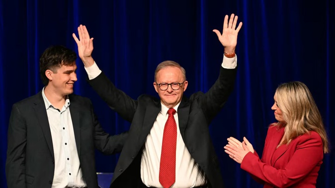 Australia's Prime Minister Anthony Albanese celebrates with his partner Jodie Haydon and son Nathan after winning the general election at the Labor Party election night event. Photo / AFP