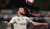 Tim Payne of the Phoenix and Brian Kaltak of the Glory contest a header during the round one A-League Men match between Perth Glory and Wellington Phoenix at HBF Park, on October 18, 2025, in Perth, Australia. (Photo by Paul Kane/Getty Images)