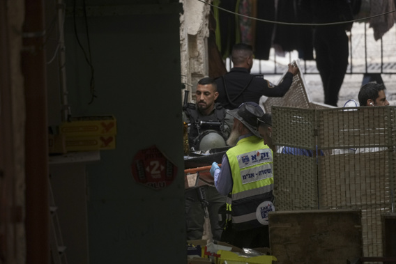 Israeli rescue workers carry the body of a Palestinian attacker from the scene of a stabbing attack in Jerusalem's Old City, Thursday, Nov. 3, 2022. The Palestinian stabbed a police officer lightly wounding him, and officers opened fire killing him, Israeli police said. Photo / AP