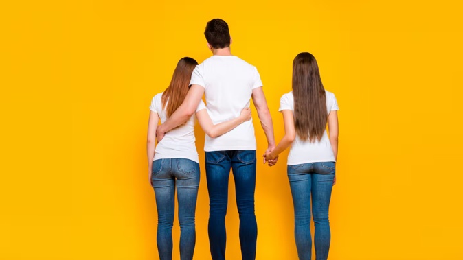 A throuple are fighting an appeal by the Attorney General to overturn a decision to allow them to have all their names on their children's birth certificates. Photo / 123RF