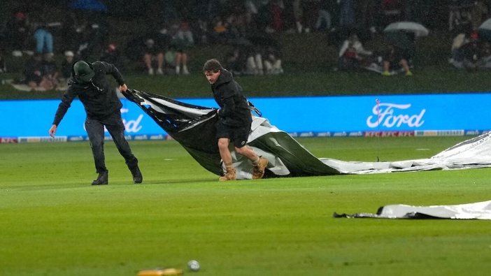 The covers go on as the rain falls during the Chappell–Hadlee T20I Series at Bay Oval. Photo / Photosport