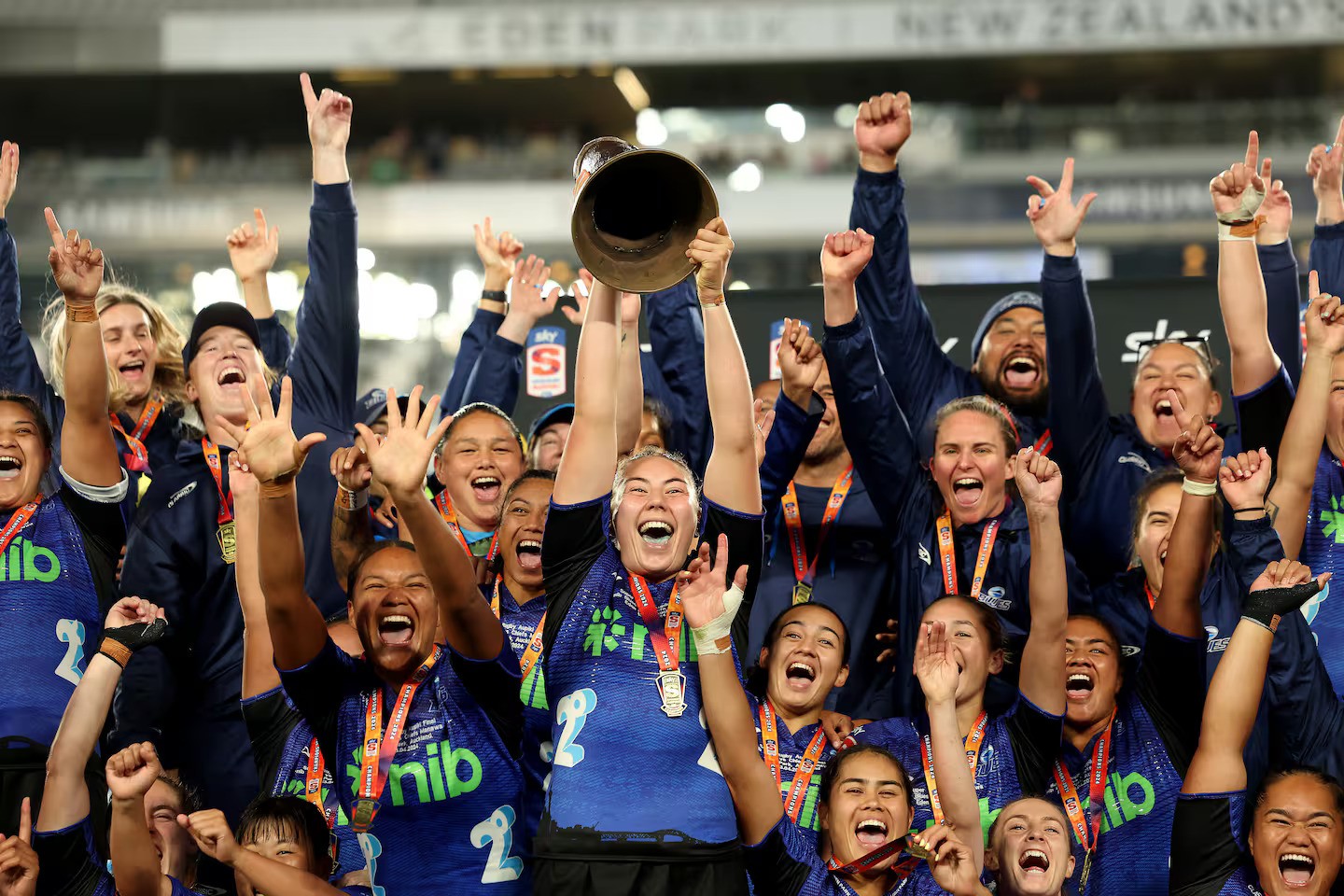 Maia Roos of the Blues holds up the Super Rugby Aupiki trophy. Photo / Getty Images