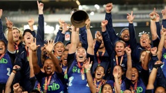 Maia Roos of the Blues holds up the Super Rugby Aupiki trophy. Photo / Getty Images