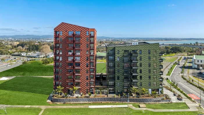 Ockham Residential and five-iwi collective Marutūāhu have developed the red Whetū apartment block (left) and the green Toi (right) at Pt Chevalier in Auckland. This is on former Unitec land. Photo / Ockham