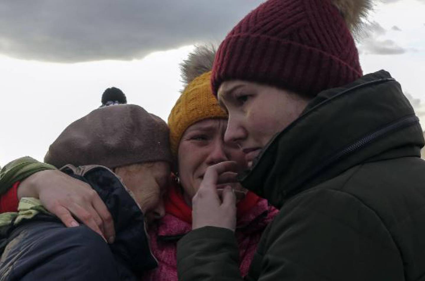 Ukrainian refugees cry as they reunite. (Photo / AP)