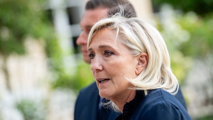 Marine Le Pen, leader of National Rally (Rassemblement National), and Jordan Bardella, president of National Rally, speak to the media after talks with French President Emmanuel Macron, at the Elysee Palace in Paris, France, on Monday, Aug. 25, 2024. Photographer: Benjamin Girette/Bloomberg via Getty Images