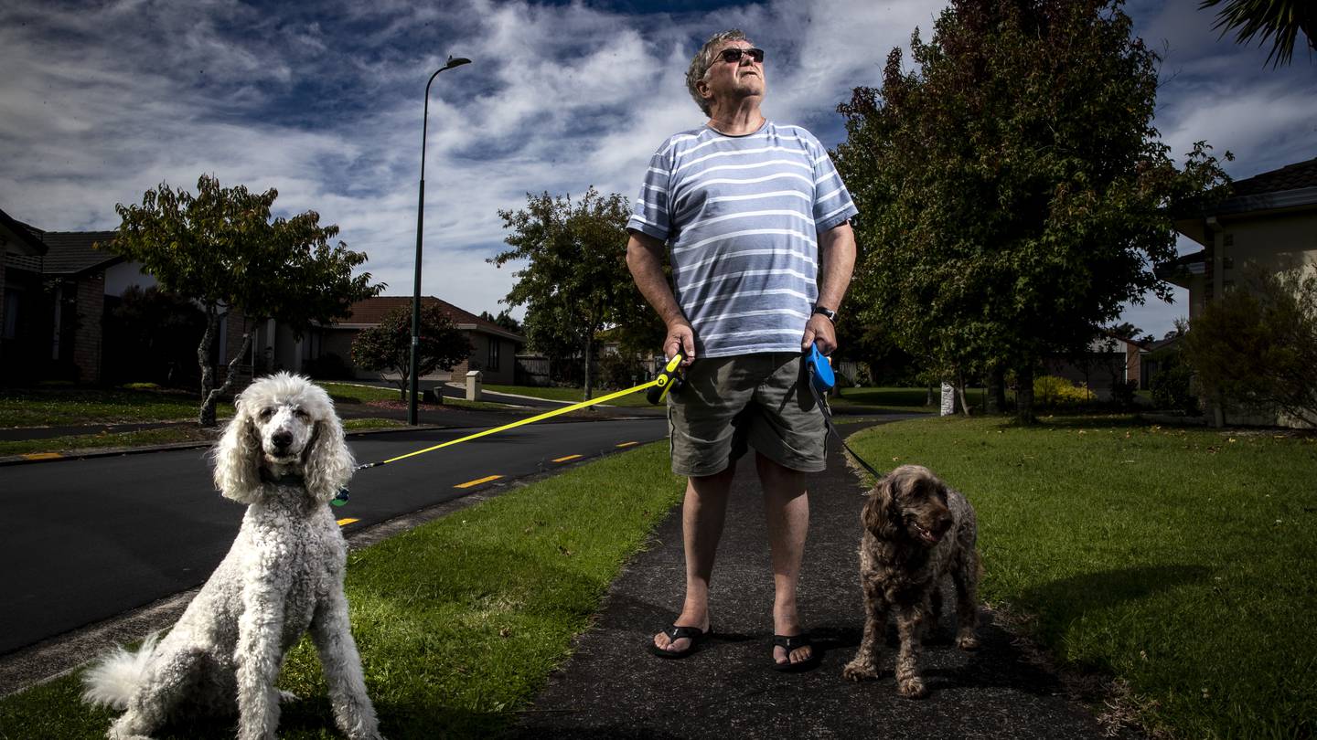 Ron Stewart, with his dogs Shilo and Minky, says he was saved from walking into the path of a tornado by his alert poodle. Photo / Michael Craig