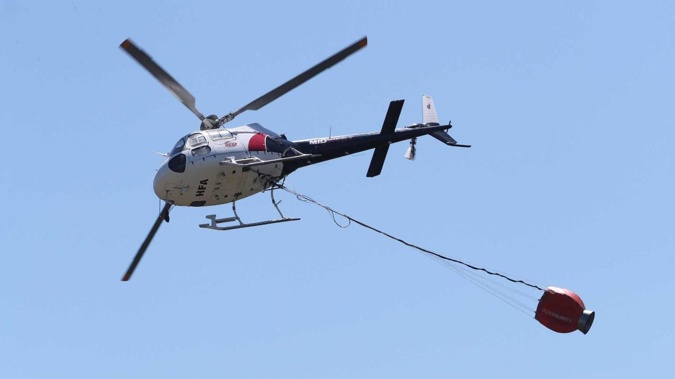 Two helicopters are fighting the blaze on Auckland's North Shore. (Photo / File)