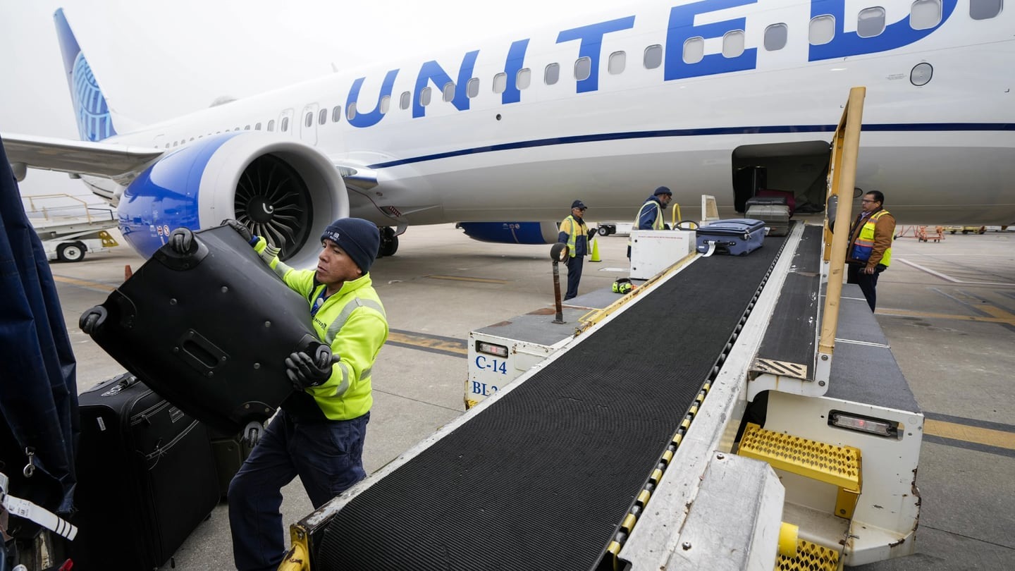 United Airlines has raised its fees for checked bags, after a similar move by American Airlines. Photo / AP