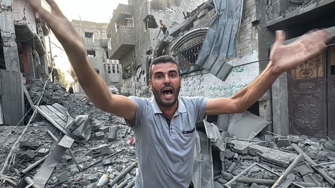 A survivor amid the rubble after an Israeli strike on the Jabalia refugee camp in the northern Gaza Strip. Photo / AFP