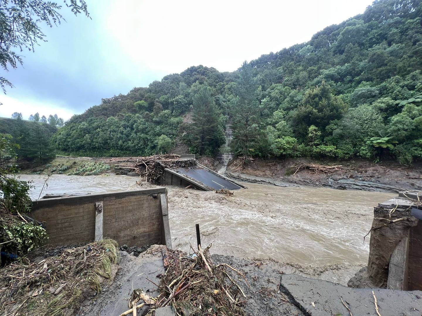 The Waikare River Bridge near Putorino collapsed on Tuesday morning following the impact of Cyclone Gabrielle. Photo / Rosie Tong