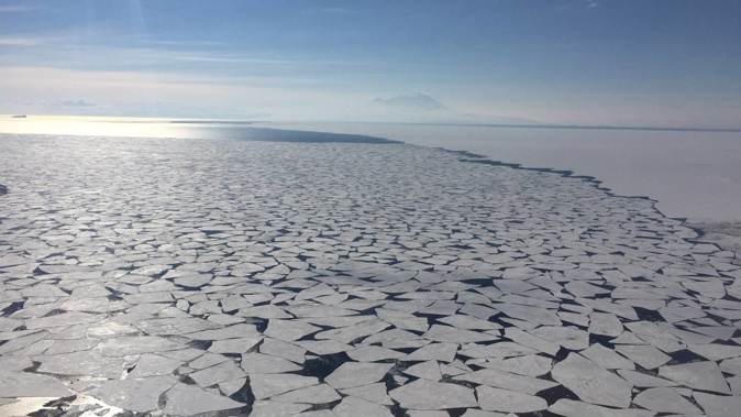 Sea ice floats near Antarctica's McMurdo Sound as Mt Erebus looms in the background. This year, Antarctica's sea ice extent has dwindled to an extreme low. Photo / Jamie Morton