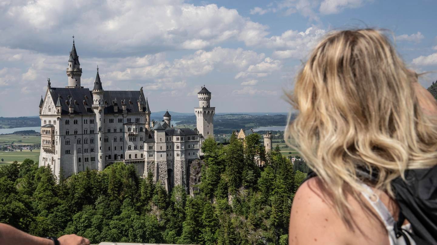 People looking at the Neuschwanstein castle, in Schwangau, Germany, where an American man has been arrested after allegedly assaulting two tourists he met near the castle. Photo / AP
