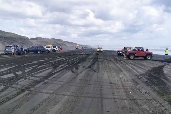Emergency services on Muriwai Beach 21 January 2024 after a car rolled ejecting a passenger from the vehicle. I person has died and three are injured. Photo / Auckland Rescue Helicopter Trust