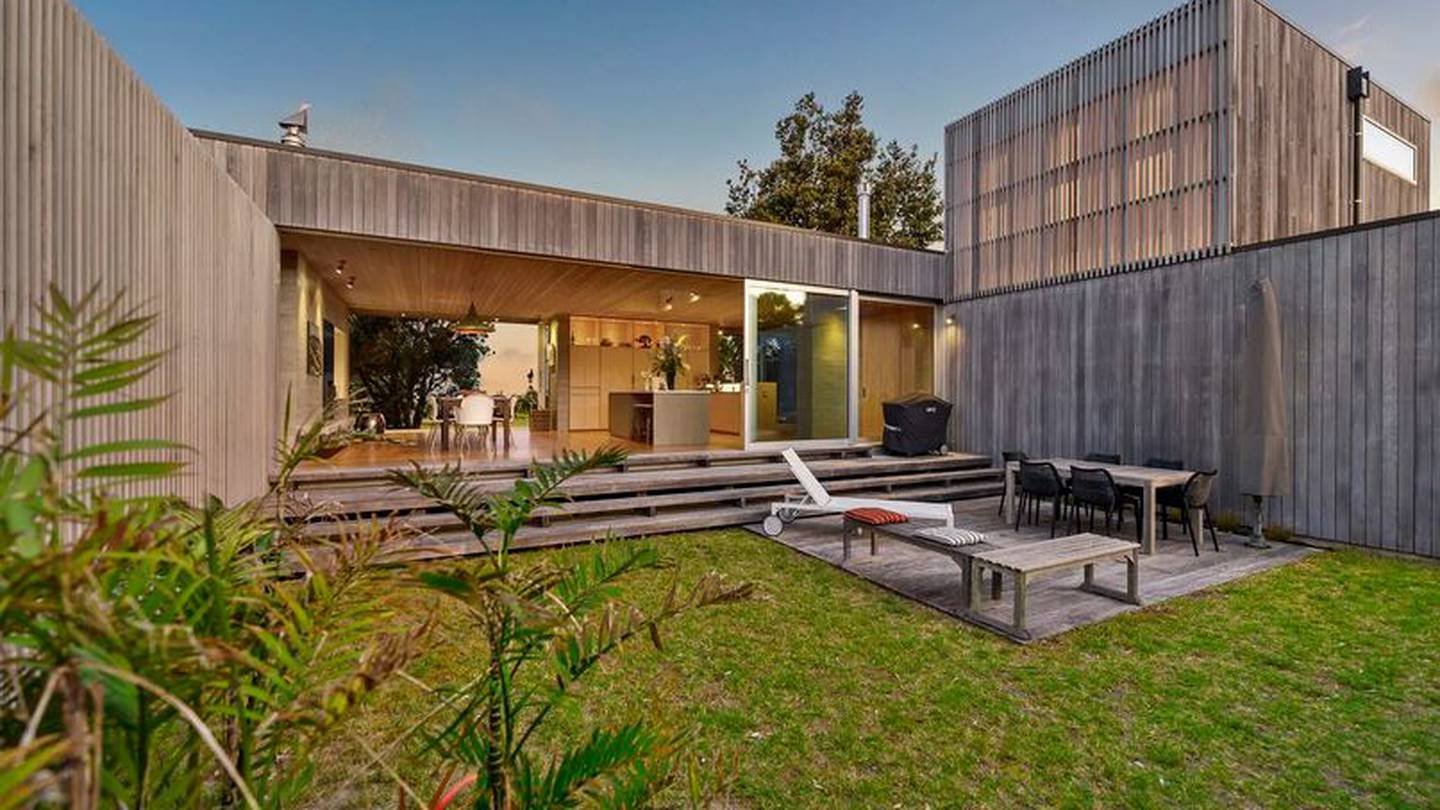 This bach at 19 Lagoon Way in Ōmaha is among the exclusive homes up for grabs in the popular beach town. Photo / Supplied