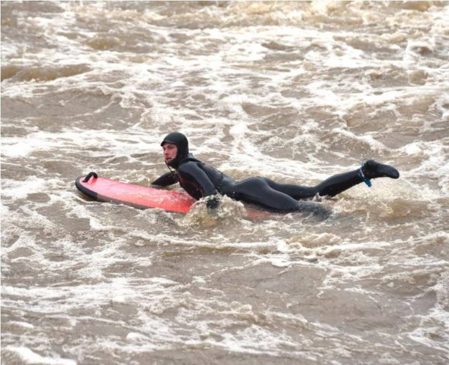 Urban surfing: Students try to catch a break on fast-flowing Dunedin river