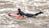 Urban surfing: Students try to catch a break on fast-flowing Dunedin river
