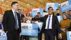 Conservative party candidate Lord Ben Houchen, left, with Britain's Prime Minister Rishi Sunak following his re-election as Tees Valley Mayor in Teesside, England, Friday May 3, 2024. (Owen Humphreys/PA via AP)