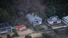 A landslide took out homes in Piha during Cyclone Gabrielle. Photo / George Heard