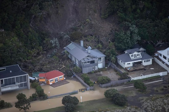 A landslide took out homes in Piha during Cyclone Gabrielle. Photo / George Heard