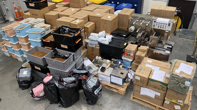 Tobacco and related items, including a cigarette-making machine, were seized by police and Customs in a raid in Christchurch in June. Photo / NZ Customs Service