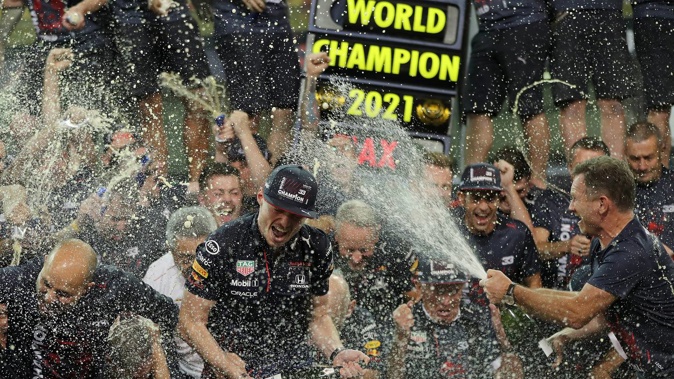 Red Bull driver Max Verstappen celebrates after becoming F1 world champion. (Photo / AP)