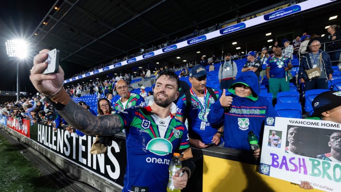 Wayde Egan takes photos with fans after the Warriors' victory over the Manly Sea Eagles. Photo / Photosport