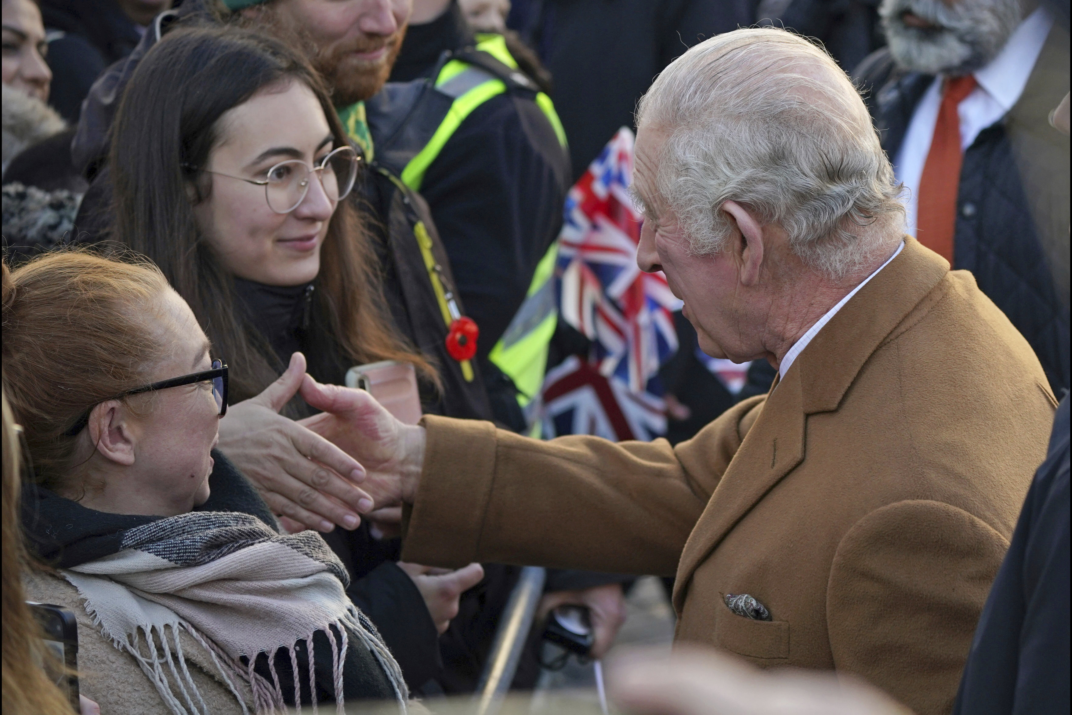 Britain's King Charles III, right, greets members of the public. Photo / AP