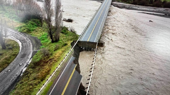 A huge volume of water washed out the abutment of the Waipawa River Bridge between Ongaonga and Tikokino on Saturday. Photo / Waka Kotahi NZTA