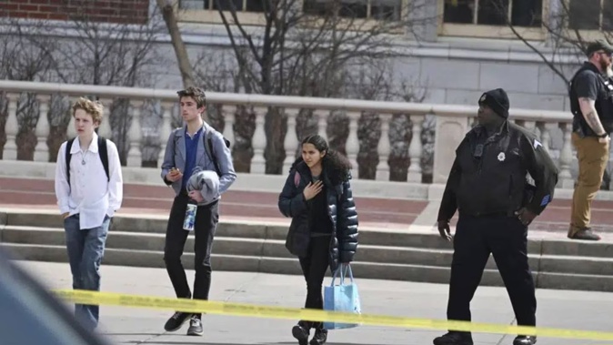Students leave East High School following a school shooting. Photo / AP