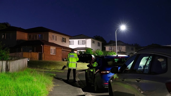 Police at the scene of another incident on the same street officers were called to earlier this week. Photo / Hayden Woodward
