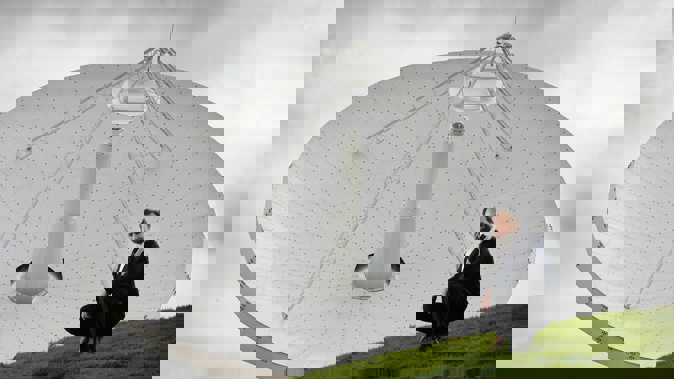 Professor Sergei Gulyaev, director of AUT's Institute of Radio Astronomy and Space Research, pictured with the Warkworth observatory's 30m radio telescope in 2008. Photo / Greg Bowker