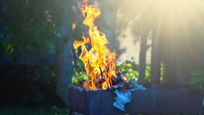 The man took her clothes to the backyard and set them on fire. Photo / 123RF