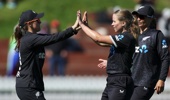 Jess Kerr (R) of New Zealand celebrates with Amelia Kerr (L) after taking the wicket of Suné Luus of South Africa during game two in the One Day International series between New Zealand and South Africa at Cello Basin Reserve on April 01, 2026 in Wellington, New Zealand. (Photo by Hagen Hopkins/Getty Images)