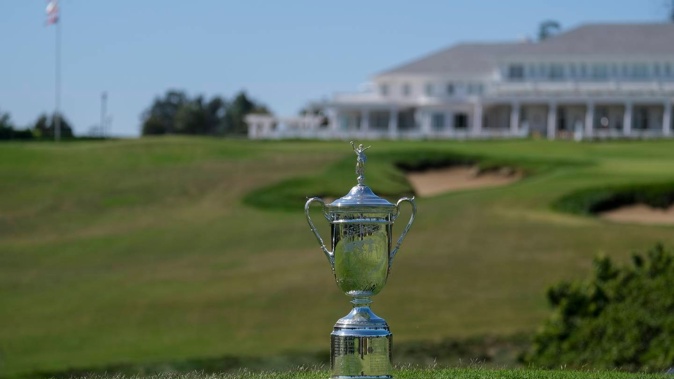A U.S. Open Championship trophy is displayed at the ninth hole at Los Angeles Country Club. Photo / AP