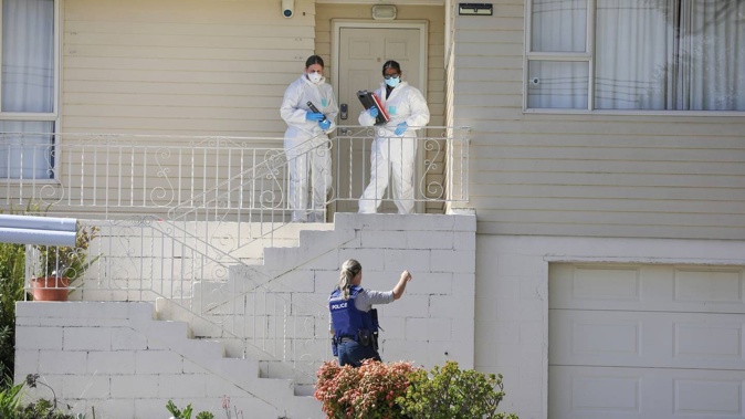 Police examine the scene where Donglan Wu stabbed her ex-husband's new partner in March 2021. Photo / Hayden Woodward