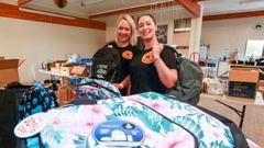 Hawke’s Bay Kids Grab & Go Bags drive founders Jenna Mabey (left) and Hena Thorn spent their weekend packing bags for their Kids Grab & Go Bags at Turning Point Church in Onekawa Napier. Photo / Paul Taylor